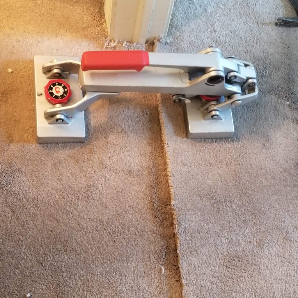 Carpet stretching Philadelphia area using mini power stretcher to stretch carper